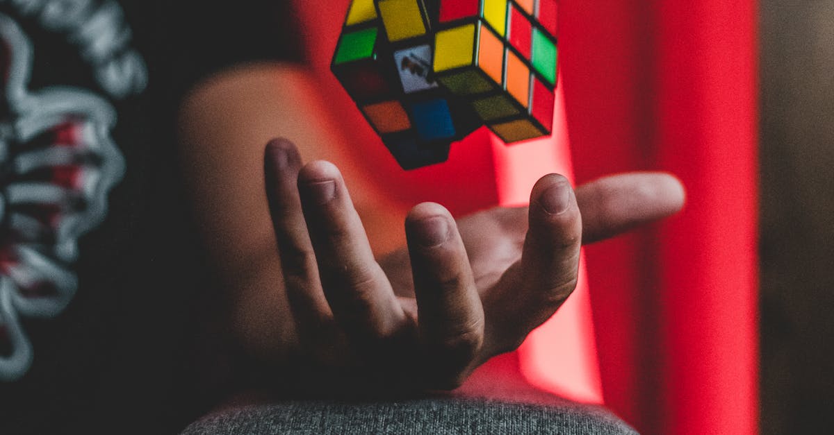 Rubik's Cube levitating over a hand with vibrant backdrop, creating a sense of whimsy and intrigue.